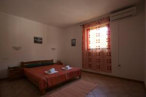 Posteľ alebo postele v izbe v ubytovaní Apartments Pinus
