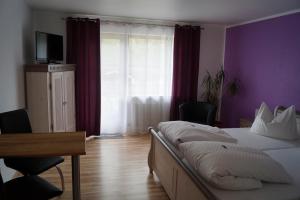 TV a/nebo společenská místnost v ubytování Gästehaus zur Mühle Dehm
