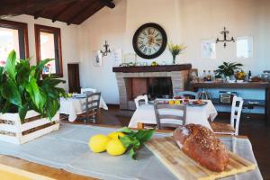 a living room with a table and a fireplace at Al Palazzetto in Tivoli