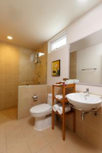 a bathroom with a white toilet and a sink at U Tiny Boutique Hotel Suvarnabhumi Bangkok - SHA Plus in Lat Krabang