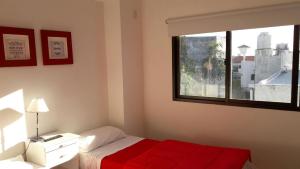 เตียงในห้องที่ Apartamento Plaza San Martin