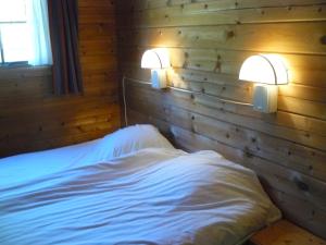 Postel nebo postele na pokoji v ubytování Chalets du Soleil