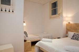 Posteľ alebo postele v izbe v ubytovaní Hostal Martinval