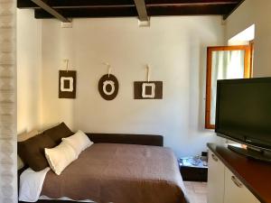 Posteľ alebo postele v izbe v ubytovaní Porto Valentino 2