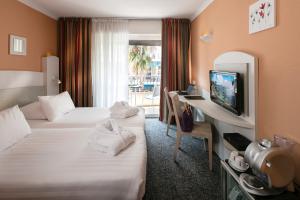 TV a/nebo společenská místnost v ubytování Best Western Astoria