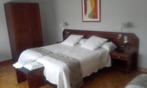 Łóżko lub łóżka w pokoju w obiekcie Villalodosa