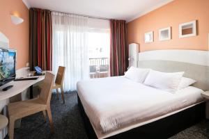 Postel nebo postele na pokoji v ubytování Best Western Astoria