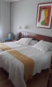 A bed or beds in a room at Villalodosa