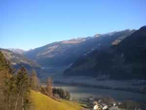 a lake in the middle of a valley with mountains at Erika Sporer in Hippach