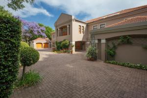 a driveway of a house with a building at 58 On Hume in Johannesburg