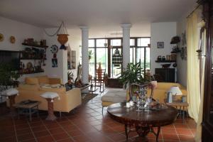 a living room with a couch and a table at B&B LA MARCHESA in SantʼAnastasia