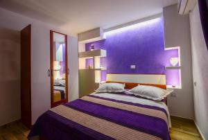 Postel nebo postele na pokoji v ubytování Apartments Luxury Oasis
