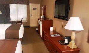 Ein Sitzbereich in der Unterkunft Heartland Inn Hotel and Suites