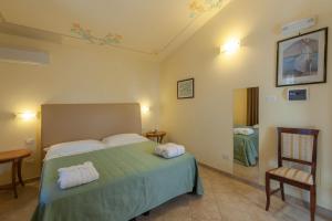 Postel nebo postele na pokoji v ubytování Hotel Saturno Fonte Pura