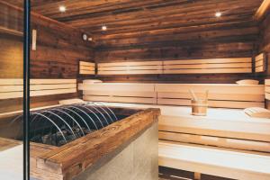 Postel nebo postele na pokoji v ubytování PUR Suites & Chalets