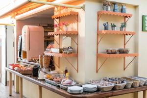 a kitchen counter with plates and food on it at L'Esterel in Cannes