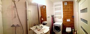 Kúpeľňa v ubytovaní Apartament Solna 106