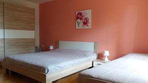 Ένα ή περισσότερα κρεβάτια σε δωμάτιο στο Giorgina Apartments