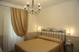 Llit o llits en una habitació de Hotel Flavia