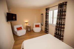 Postel nebo postele na pokoji v ubytování Hotel Cesario + 37 fotografií