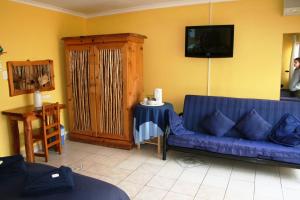 Zona de estar de Flintstones Guest House Durban