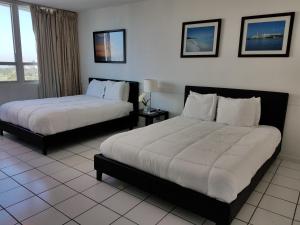 Ένα ή περισσότερα κρεβάτια σε δωμάτιο στο L&D Vacations Rentals