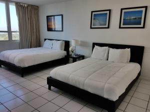 Ένα ή περισσότερα κρεβάτια σε δωμάτιο στο L&D Vacations Rentals +43 φωτογραφίες