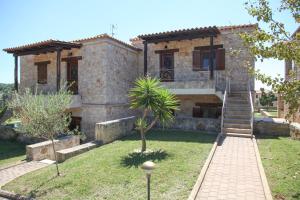 a house with a staircase in front of it at Jordan's Stone House in Siviri