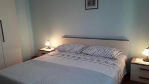 Postel nebo postele na pokoji v ubytování Apartment Marisa