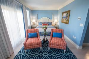 two beds sitting next to each other in a room at Harborside at Charleston Harbor Resort and Marina in Charleston