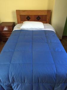 Postel nebo postele na pokoji v ubytování Rumi Sonqo Hostel