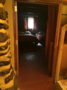 Postel nebo postele na pokoji v ubytování Rumi Sonqo Hostel