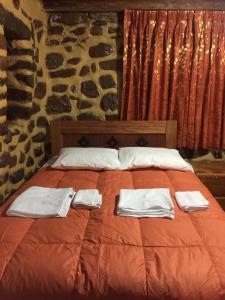 Postel nebo postele na pokoji v ubytování Rumi Sonqo Hostel