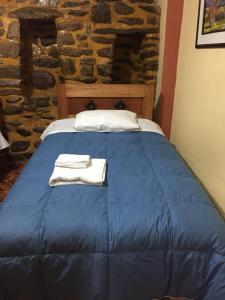 Postel nebo postele na pokoji v ubytování Rumi Sonqo Hostel