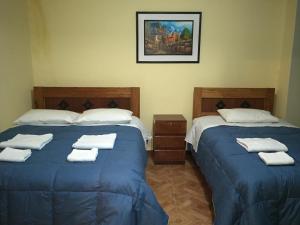 Postel nebo postele na pokoji v ubytování Rumi Sonqo Hostel
