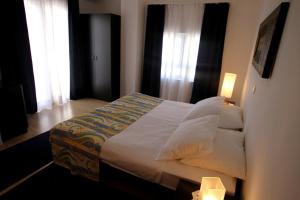 Postel nebo postele na pokoji v ubytování Apartments Macolic