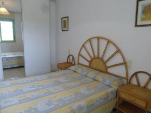 Postel nebo postele na pokoji v ubytování Rentalmar Port Gavina