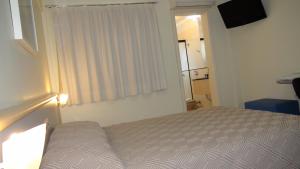 Katil atau katil-katil dalam bilik di Asppen Hotel