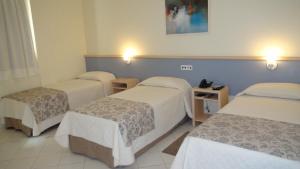 Katil atau katil-katil dalam bilik di Asppen Hotel