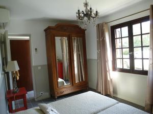 a bedroom with a mirror and a dresser and a window at I Mucchi in Galeria +30 photos