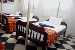 Postel nebo postele na pokoji v ubytování Kimte Beach Lodge