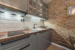 Kuchyň nebo kuchyňský kout v ubytování Apartments Fontana + 37 fotografií