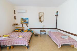 Postel nebo postele na pokoji v ubytování Yoga & Apartment Zlata Oliva
