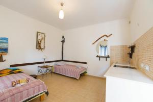 Postel nebo postele na pokoji v ubytování Yoga & Apartment Zlata Oliva