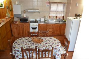 A cozinha ou cozinha compacta de Cabañas Bosque Del Faldeo