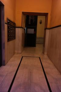 an empty hallway with a door to a wine cellar at Happy Rome in Rome