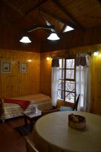 Cama ou camas em um quarto em Cabañas Bosque Del Faldeo