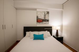 Giường trong phòng chung tại Mariel Hotel Boutique
