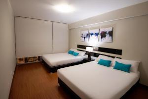 Giường trong phòng chung tại Mariel Hotel Boutique