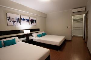 Giường trong phòng chung tại Mariel Hotel Boutique